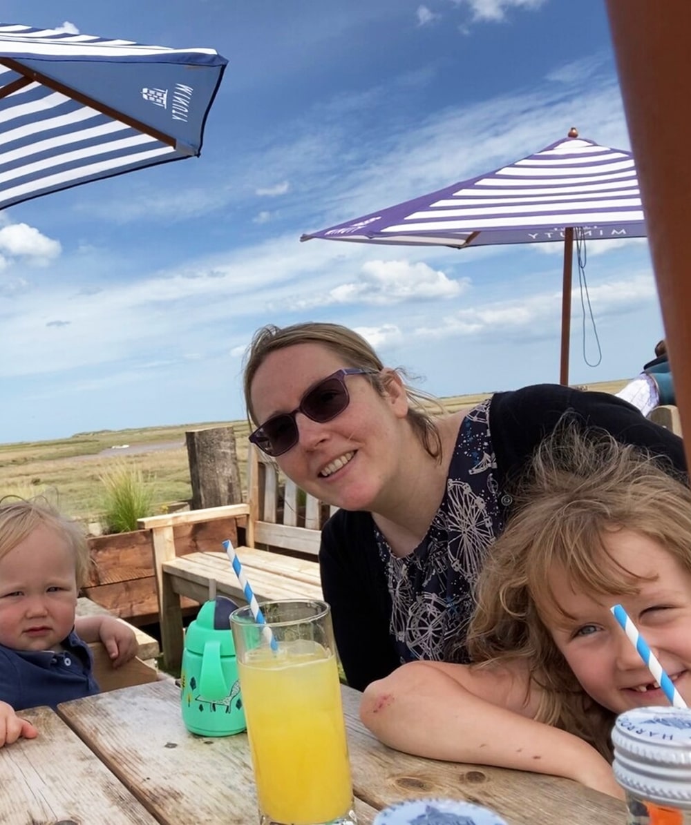 Gini at the seaside with her family (Gini is a non-smoking lung cancer ambassador)