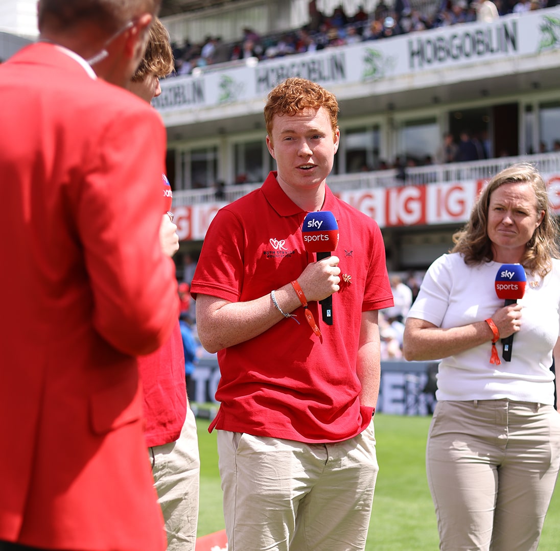 Henry giving an interview and discussing anticipatory grief with Sky Sports during the 2024 Red for Ruth event at Lord's Cricket Ground.