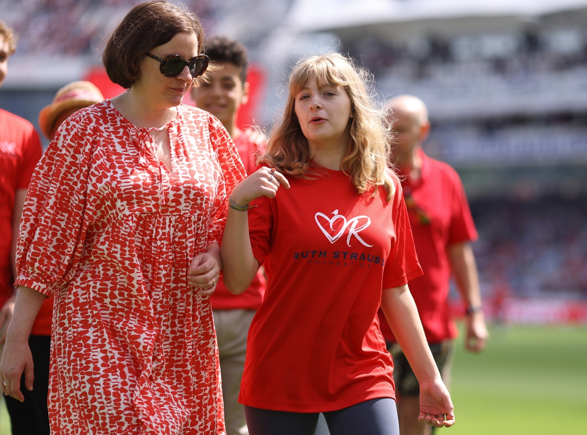 Nina with her daughter during the Red for Ruth Day 2024 event, supporting the Foundation’s mission.